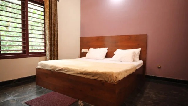 Garden view bedroom with attached bathroom